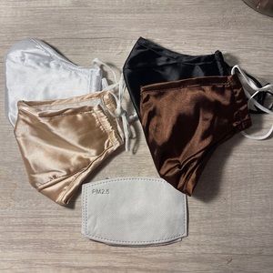 Never Worn Facemasks - Set of 4